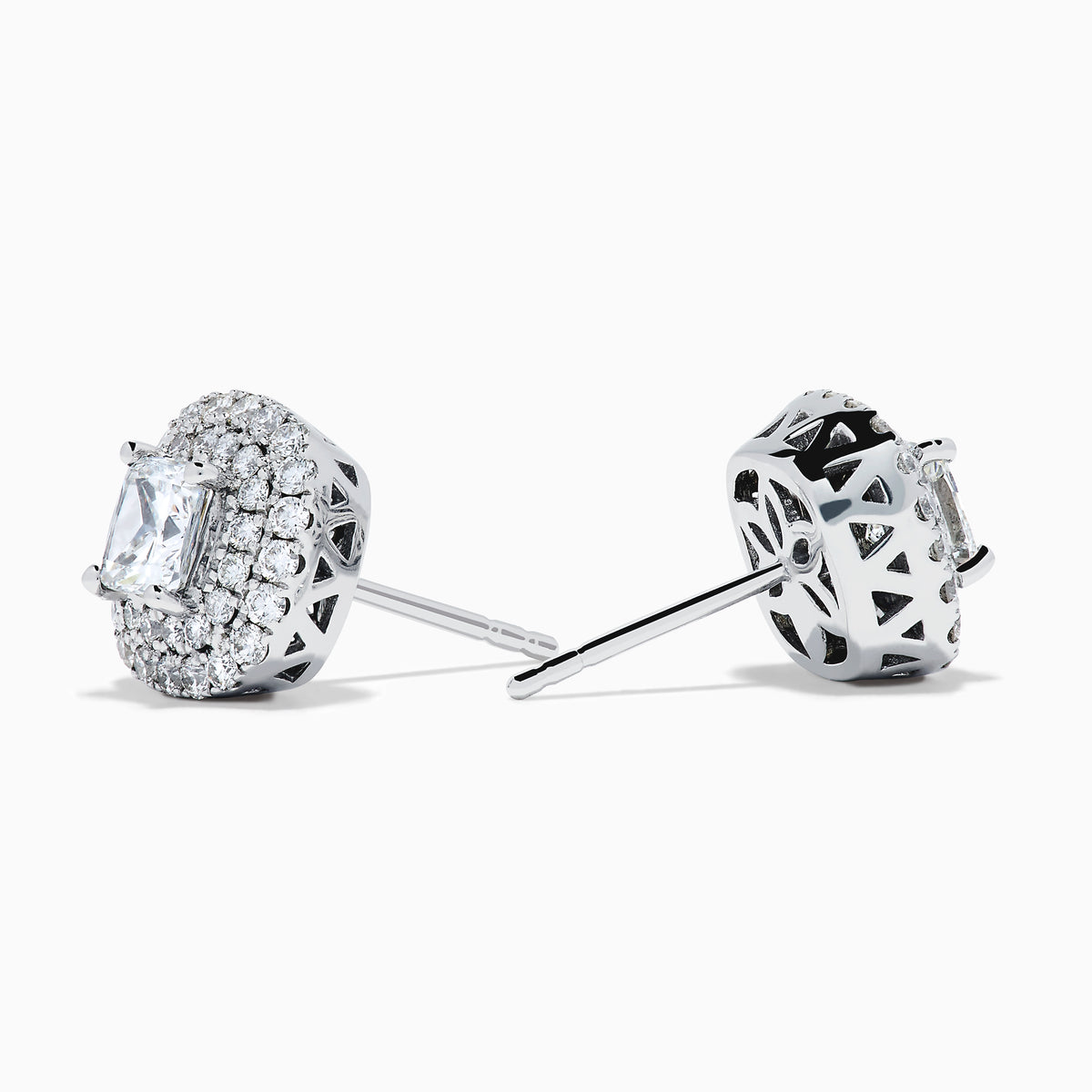The 18K White Gold Diamond Double Halo Cushion Stud Earrings feature cushion-cut diamonds surrounded by double halos of smaller diamonds, set in 18K white gold and displayed on a white background.