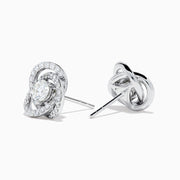 The 18K White Gold Diamond Love Knot Stud Earrings feature interlocking loops with sparkling diamonds and a central pear-shaped diamond, all set in elegant white gold against a plain white background.