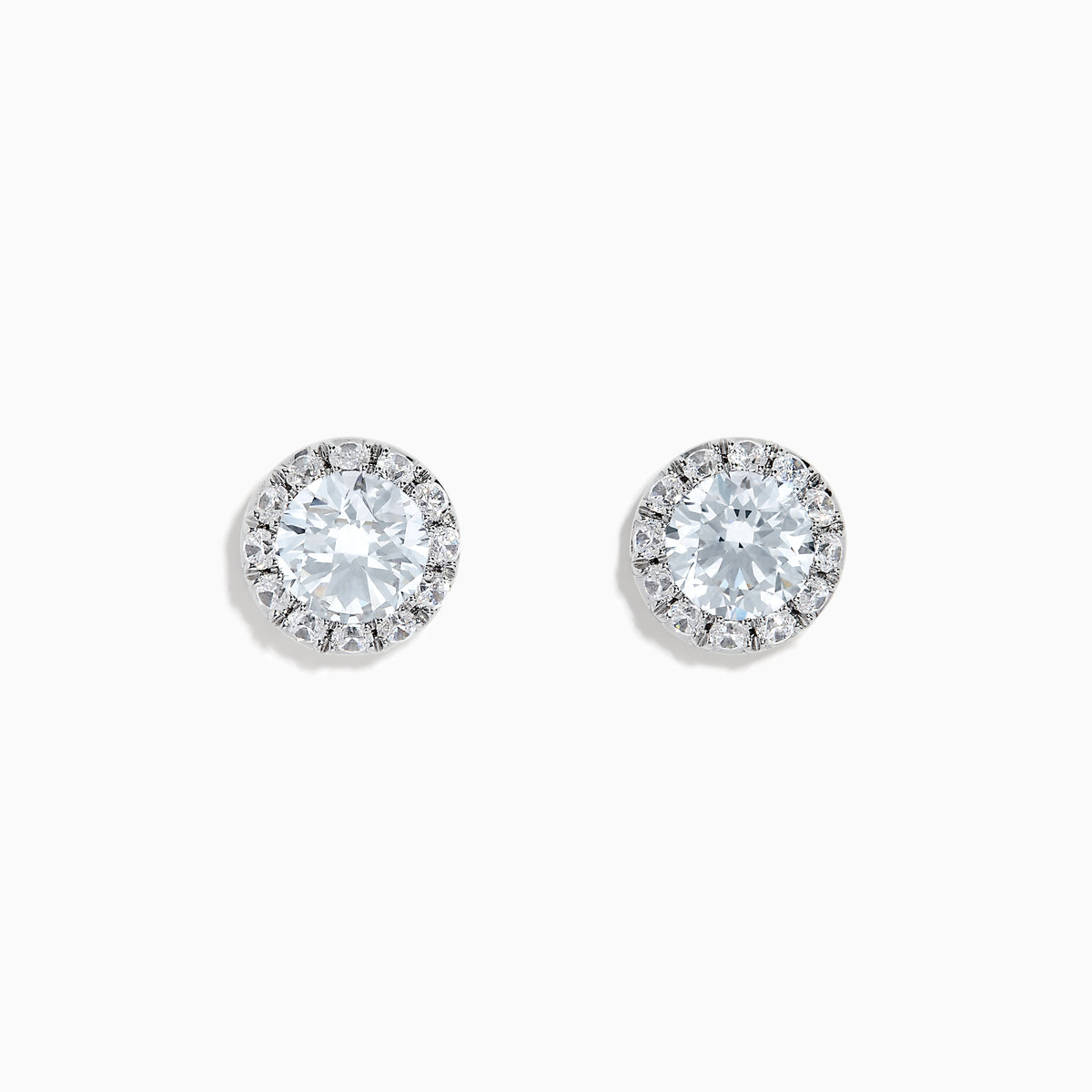 A pair of 14K White Gold Lab Grown Diamond Earrings with a central round diamond and a halo of smaller lab grown diamonds, set against a white background.