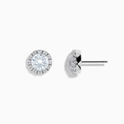 A pair of 14K White Gold Lab Grown Diamond Earrings with a central round diamond and a halo of smaller lab grown diamonds, set against a white background.