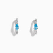Lab Grown Blue and White Diamond Hoop Earrings in 14K White Gold, each with a teardrop-shaped blue gemstone and sparkling lab grown diamonds along the hoops, shown against a white background.