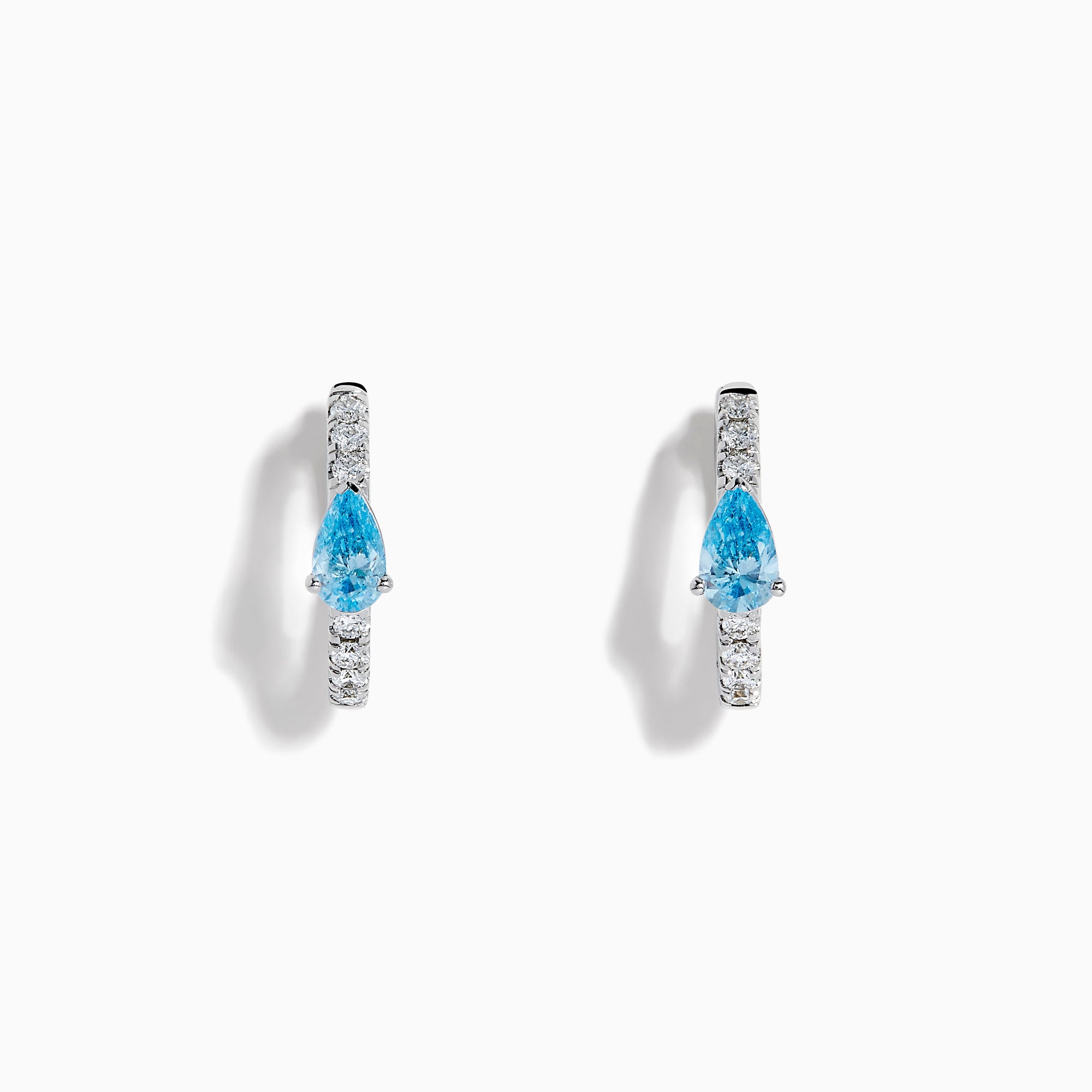 Lab Grown Blue and White Diamond Hoop Earrings in 14K White Gold, each with a teardrop-shaped blue gemstone and sparkling lab grown diamonds along the hoops, shown against a white background.