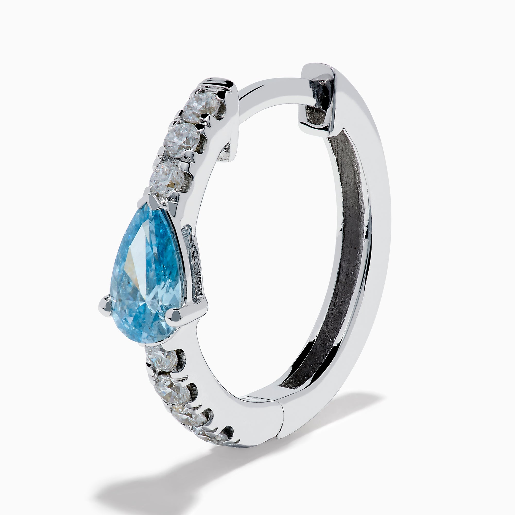 A pair of Lab Grown Blue and White Diamond Hoop Earrings in 14K White Gold, featuring a large pear-shaped blue gemstone and a row of small lab grown diamonds, is shown on a white background.