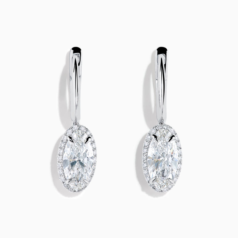 The Lab Grown Diamond Elongated Oval Drop Earrings in 14K White Gold feature clear gemstones surrounded by lab grown diamonds, set in polished white gold with a simple hook design, displayed against a white background.