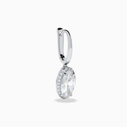 The Lab Grown Diamond Elongated Oval Drop Earrings in 14K White Gold feature clear gemstones surrounded by lab grown diamonds, set in polished white gold with a simple hook design, displayed against a white background.