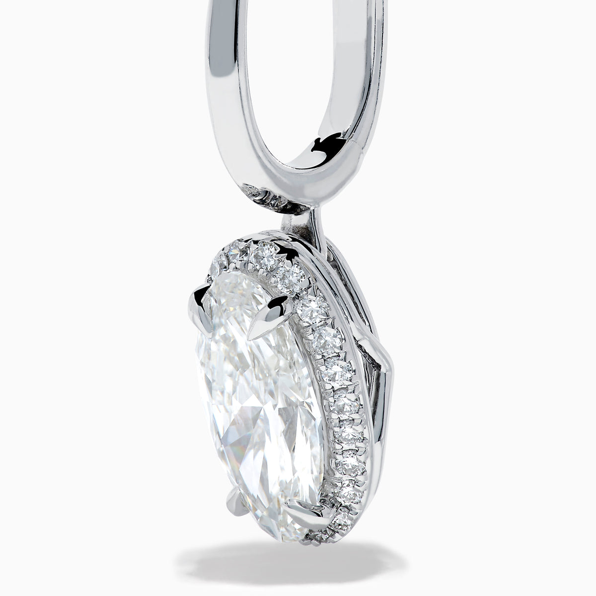The Lab Grown Diamond Elongated Oval Drop Earrings in 14K White Gold feature clear gemstones surrounded by lab grown diamonds, set in polished white gold with a simple hook design, displayed against a white background.