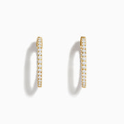 The 14K Yellow Gold 3/4 Diamond Hoop Earrings (0.74 TCW) are shown against a white background—one from the side, one from the front—to showcase their sparkling white diamonds and dazzling brilliance.