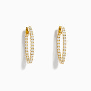 The 14K Yellow Gold 3/4 Diamond Hoop Earrings (0.74 TCW) are shown against a white background—one from the side, one from the front—to showcase their sparkling white diamonds and dazzling brilliance.