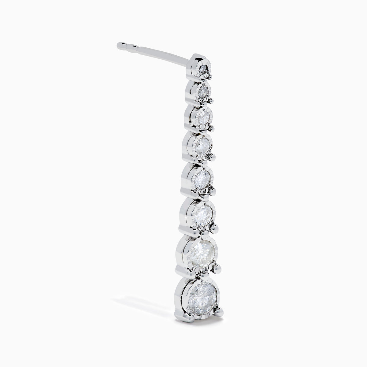 The 925 Sterling Silver Diamond Linear Drop Earrings showcase a vertical row of round, graduated diamonds that increase in size towards the bottom.