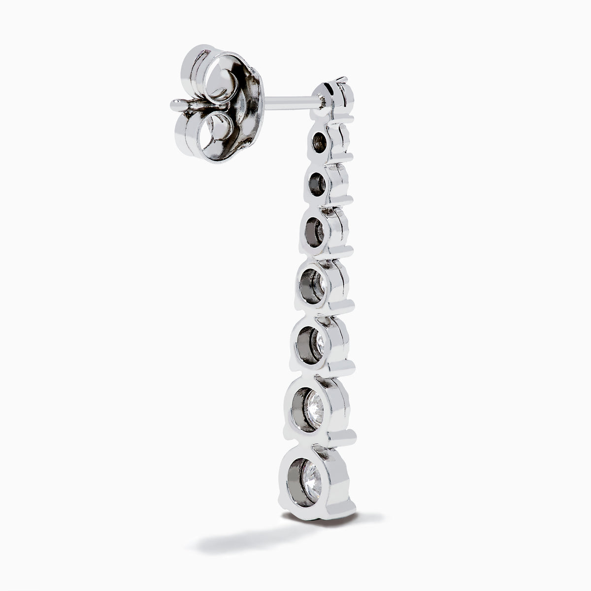 The 925 Sterling Silver Diamond Linear Drop Earrings showcase a vertical row of round, graduated diamonds that increase in size towards the bottom.