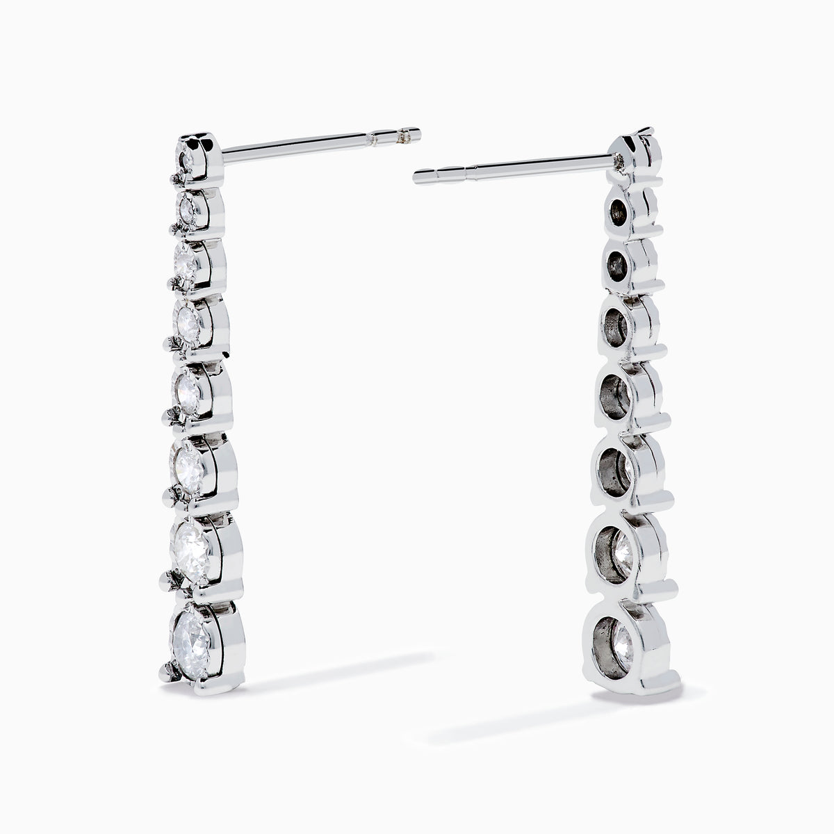 The 925 Sterling Silver Diamond Linear Drop Earrings showcase a vertical row of round, graduated diamonds that increase in size towards the bottom.
