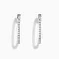 The Pave Classica 14K White Gold Diamond Hoop Earrings, encrusted with sparkling diamonds, are shown against a white background with soft shadows cast to the left.