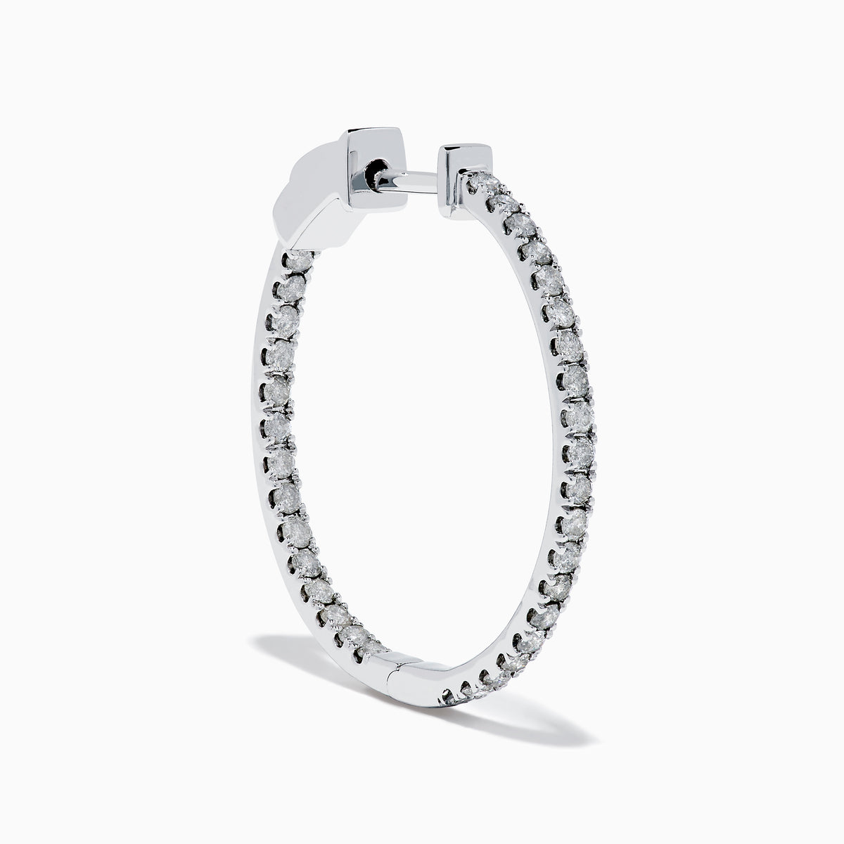 The Pave Classica 14K White Gold Diamond Hoop Earrings, encrusted with sparkling diamonds, are shown against a white background with soft shadows cast to the left.