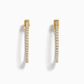 The DOro 14K Yellow Gold Diamond 1 Hoop Earrings feature sparkling diamonds and are shown vertically on a white background.