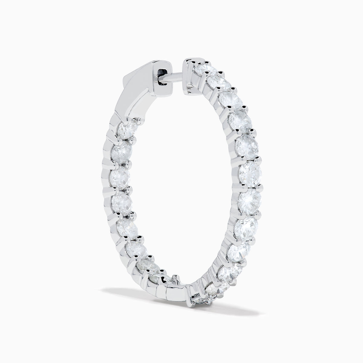 A stunning pair of 14K White Gold Diamond Inside Out 1" Hoop Earrings, each adorned with a row of brilliant round white diamonds, displayed vertically against a white background with soft shadows. These hoop earrings are designed in an inside out style, ensuring each diamond sparkles beautifully from every angle.