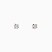 A pair of 14K white & rose gold diamond solitaire stud earrings, 0.10 TCW, shown on a plain white background.