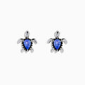 A pair of 925 Silver Tanzanite and Diamond Turtle Stud Earrings, featuring turtle shapes with blue tanzanite centers, displayed on a white background.