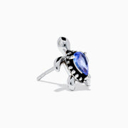A pair of 925 Silver Tanzanite and Diamond Turtle Stud Earrings, featuring turtle shapes with blue tanzanite centers, displayed on a white background.