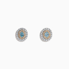 The 18K Two Tone Gold Certified Natural Blue and White Diamond Stud Earrings feature a central blue gemstone framed by two rows of natural diamonds in a circular design with elegant gold details.