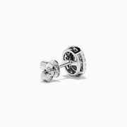 The 18K Two Tone Gold Certified Natural Blue and White Diamond Stud Earrings feature a central blue gemstone framed by two rows of natural diamonds in a circular design with elegant gold details.