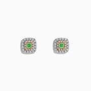 The 18K Two Tone Gold AGL Certified Natural Green and White Diamond Stud Earrings feature a square design with a green diamond center, two rows of clear diamonds, in silver and gold setting, shown on a white background.