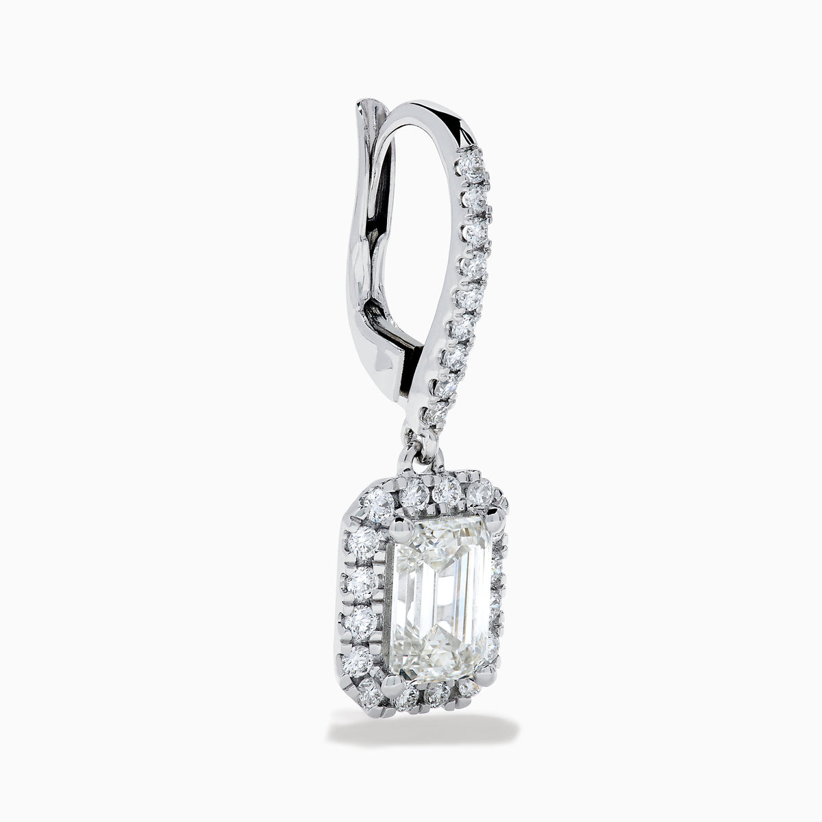 The Lab Grown Diamond Emerald Cut Dangle Earrings in 14K White Gold showcase emerald cut lab grown centers with a halo of round diamonds and diamond-encrusted hooks, elegantly presented against a white background.