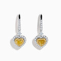 The Canare 18K Two Tone Gold White & Yellow Diamond Heart Earrings feature heart-shaped yellow stones, a halo of white diamonds, and diamond-accented hooks for elegant sparkle.