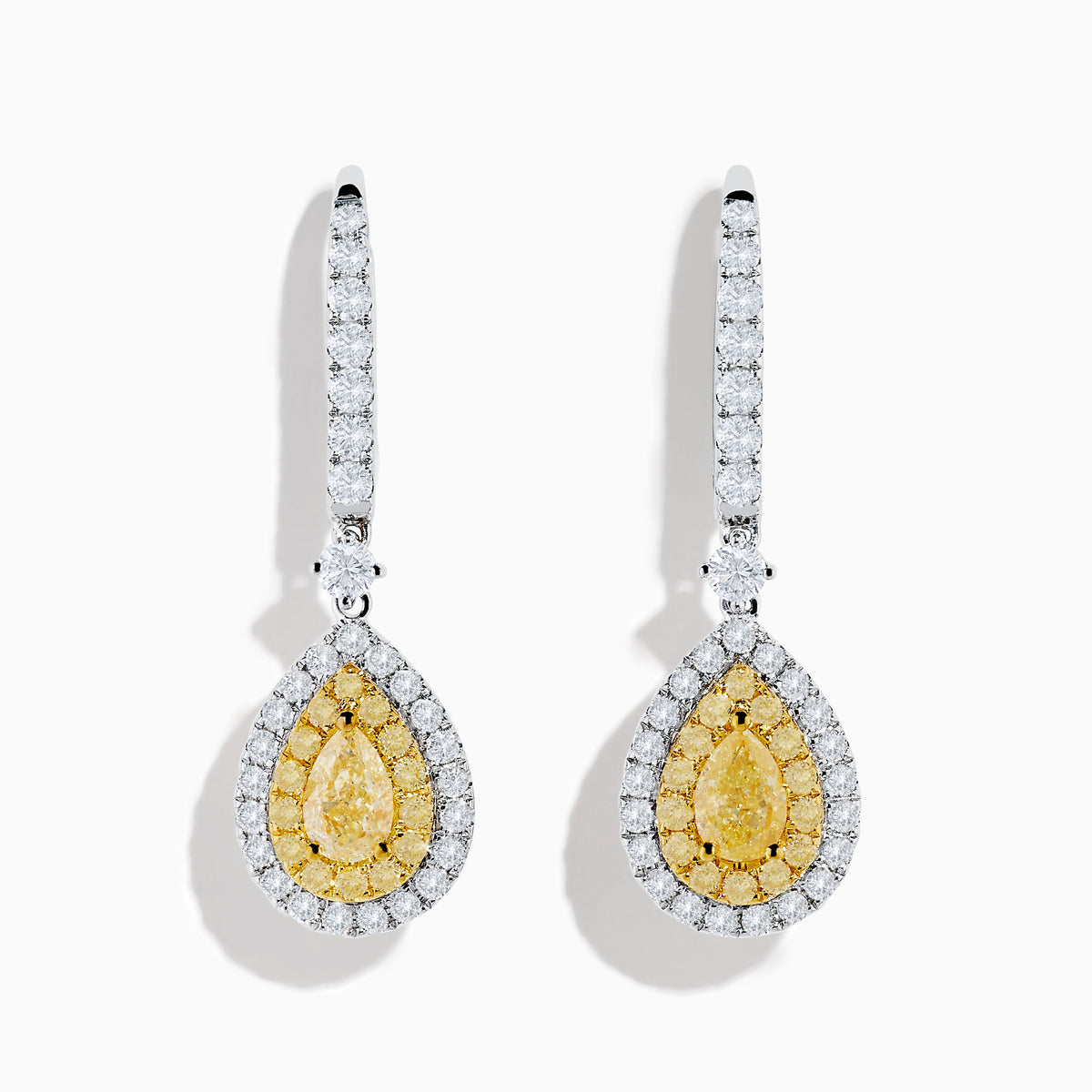 The Canare 18K Two Tone Gold White and Yellow Diamond Drop Earrings feature teardrop-shaped yellow gems encircled by white diamonds, with diamond-adorned hooks, all set in elegant two-tone gold.