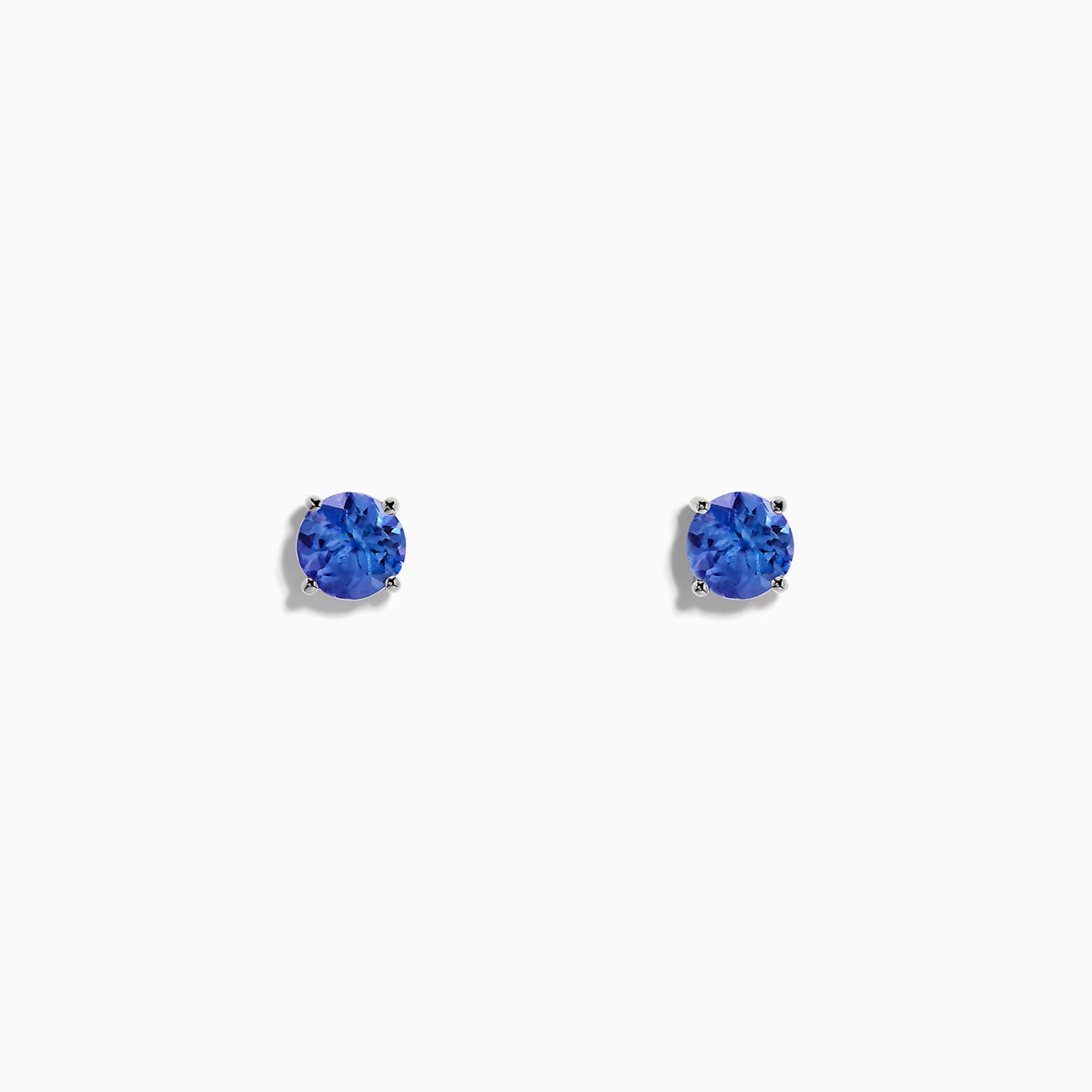 14K White Gold Tanzanite Stud Earrings featuring round blue gemstones in white gold prongs are displayed against a plain white background.
