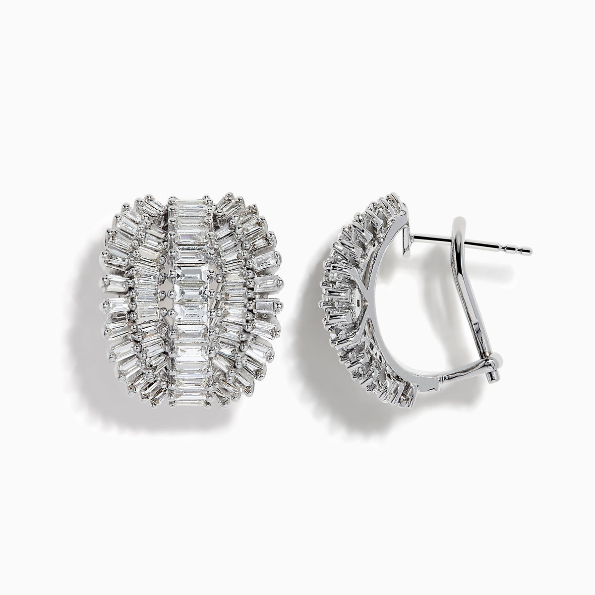 Classique 14k White Gold Diamond Earrings feature oval shapes with rows of baguette-cut diamonds in a layered, ribbed design, all set in 14k white gold against a plain white background.