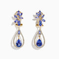 14K yellow gold tanzanite and diamond earrings featuring marquise and pear-shaped blue stones, accented with diamonds in a floral cluster at the top and a teardrop dangle design below.