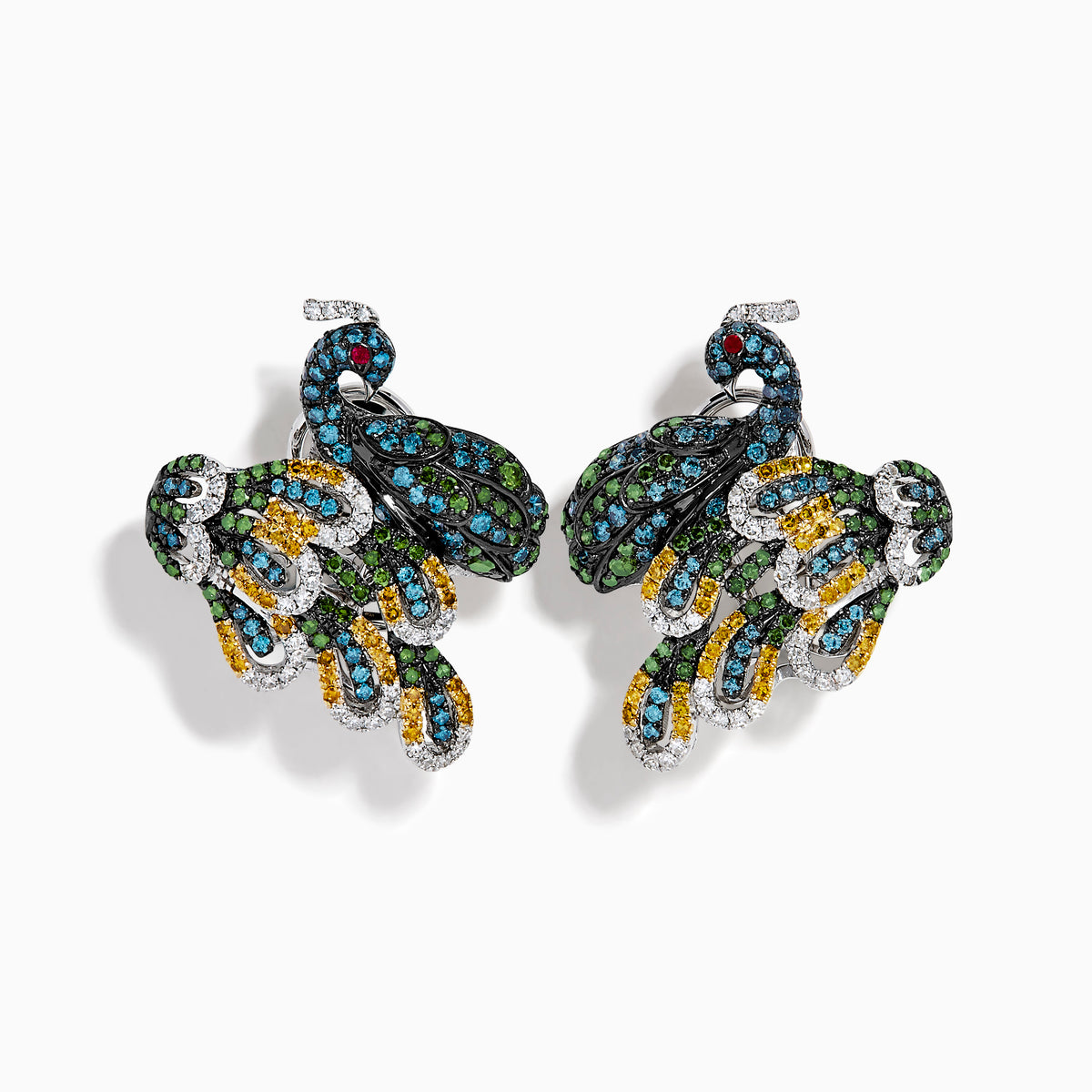 The 14K White Gold Multi Color Diamond and Ruby Peacock Earrings feature ornate peacock designs with blue, green, yellow, and clear gemstones and ruby eyes, elegantly displayed on a white background.