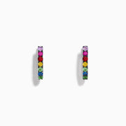 Watercolors 14K White Gold Multi Sapphire Huggie Hoop Earrings featuring multicolored sapphires set in a vertical line, showcased against a plain white background.