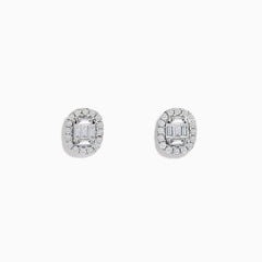 The Classique 14K White Gold Diamond Stud Earrings 0.59 TCW feature oval studs with central baguette-cut diamonds, each encircled by a halo of sparkling round stones.