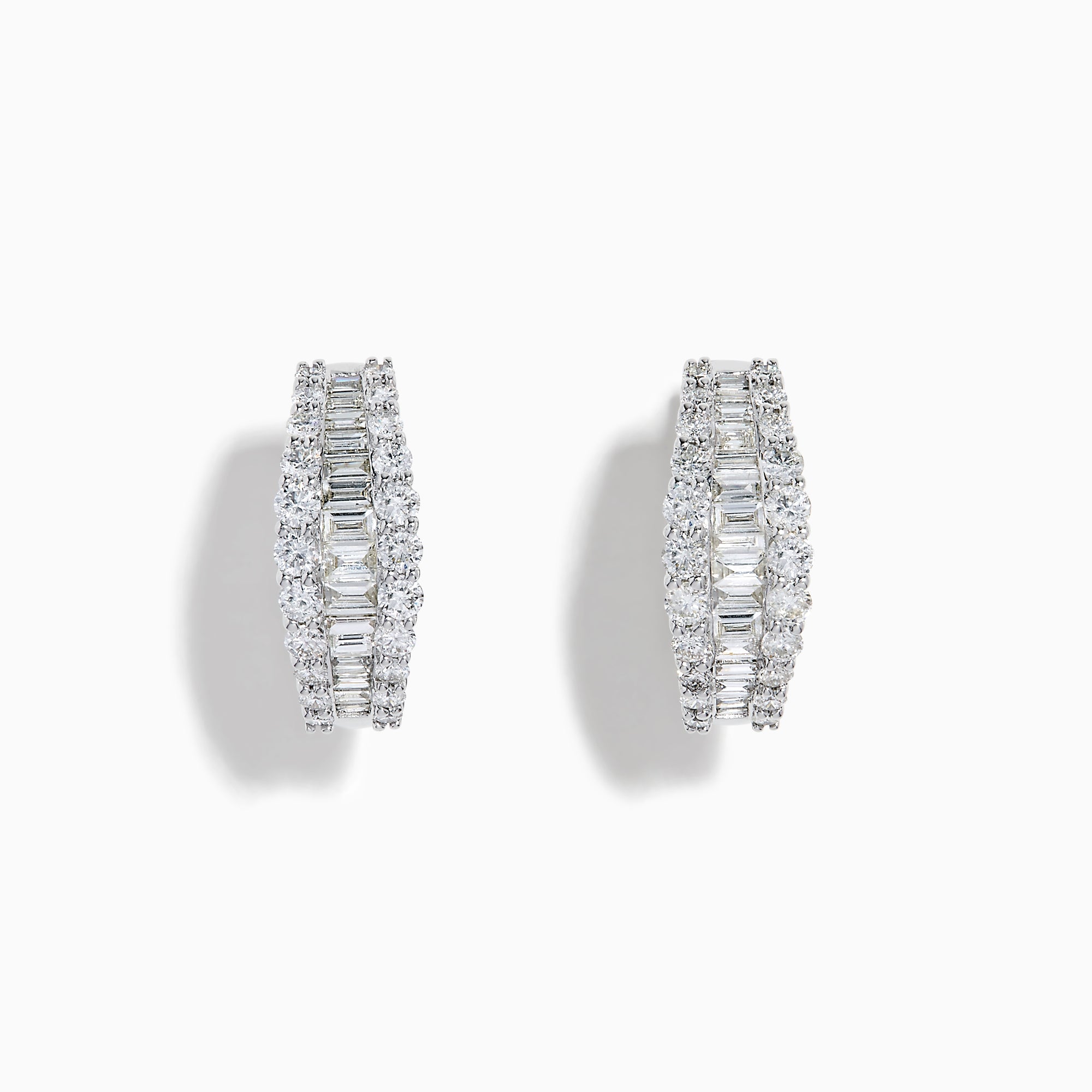 The Classique 14K White Gold Diamond Hoop Earrings feature rows of rectangular and round-cut diamonds, offering a sparkling and timeless look, beautifully displayed on a plain white background.