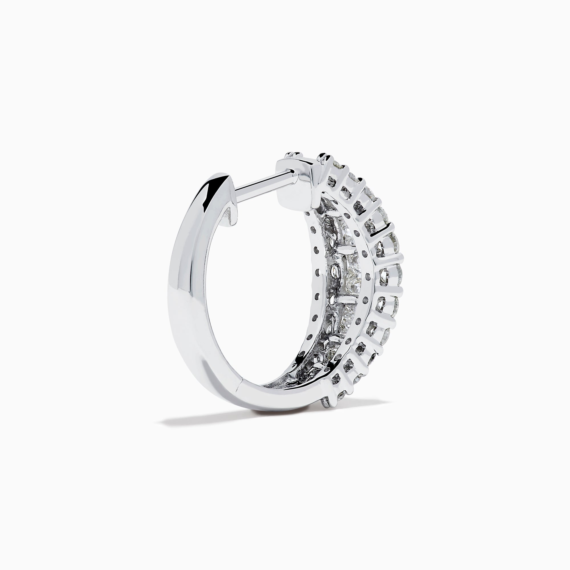The Classique 14K White Gold Diamond Hoop Earrings feature rows of rectangular and round-cut diamonds, offering a sparkling and timeless look, beautifully displayed on a plain white background.