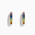 The Watercolor 14k Yellow Gold Princess Cut Multi Sapphire Hoop Earrings feature a rainbow gradient of square-cut sapphires—purple, blue, green, yellow, and orange—set on hoops and shown against a white background.