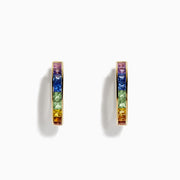 The Watercolor 14k Yellow Gold Princess Cut Multi Sapphire Hoop Earrings feature a rainbow gradient of square-cut sapphires—purple, blue, green, yellow, and orange—set on hoops and shown against a white background.