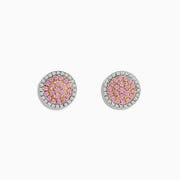These 14K Two Tone Gold Pink and White Diamond Earrings feature a cluster of pink stones at the center, encircled by clear diamonds in a round design.