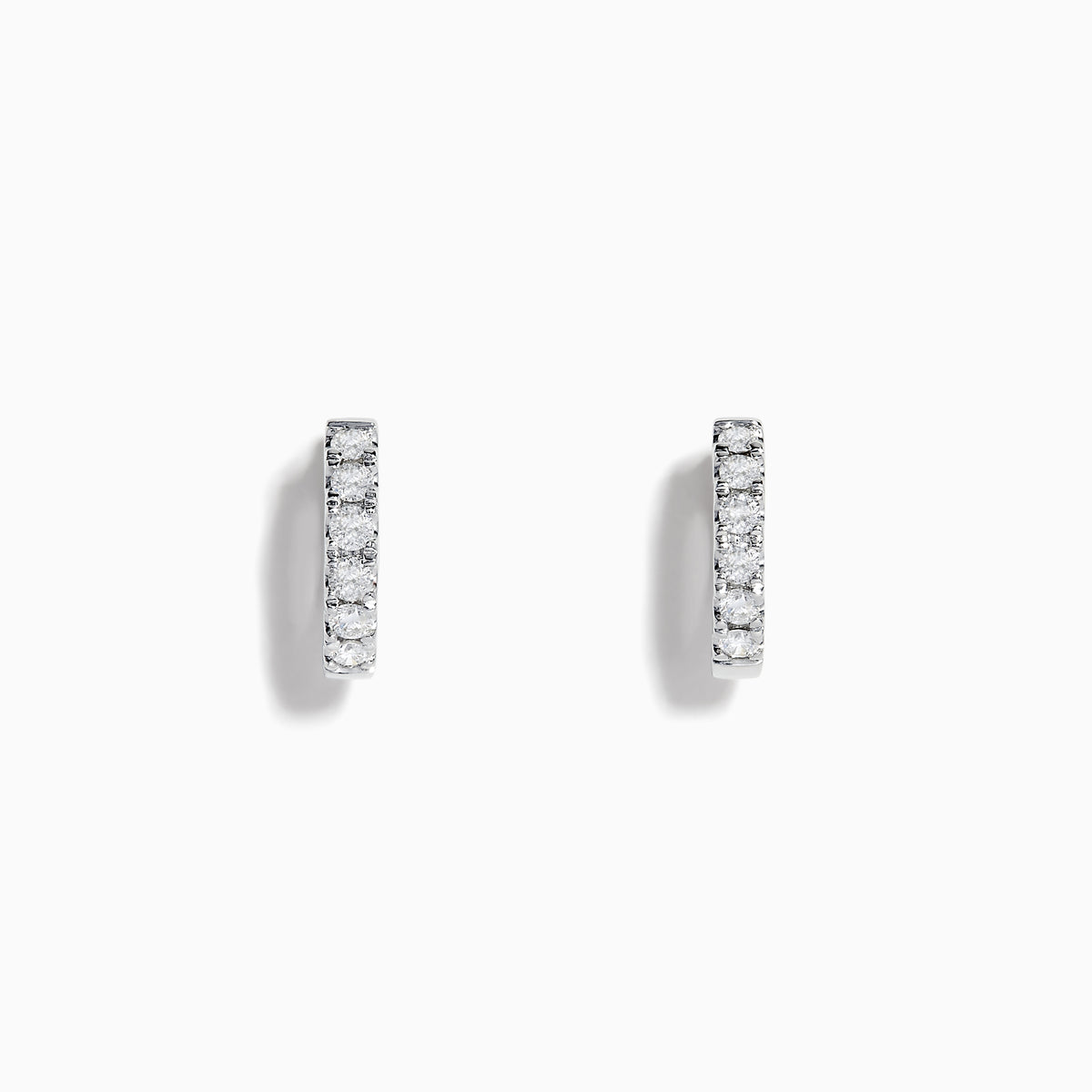 A pair of Pave Classica 14k White Gold Diamond Huggie Earrings, each set with a row of sparkling diamonds, displayed on a plain white background.