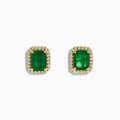 The Brasillica 14K Yellow Gold Emerald and Diamond Earrings feature rectangular green gems bordered by sparkling diamonds on a plain white background—ideal for those seeking elegant and luxurious emerald stud earrings.
