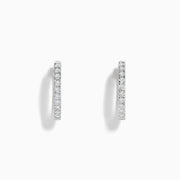 A pair of Pave Classica 14k White Gold 5/8 Diamond Hoop Earrings 0.49 TCW, featuring sparkling diamonds, displayed against a plain white background.