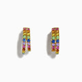 The Watercolor 14k Yellow Gold Multi Sapphire Huggie Earrings feature two rows of sapphires in vibrant yellow, pink, blue, green, and purple hues, beautifully displayed on a white background.