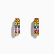 The Watercolor 14k Yellow Gold Multi Sapphire Huggie Earrings feature two rows of sapphires in vibrant yellow, pink, blue, green, and purple hues, beautifully displayed on a white background.