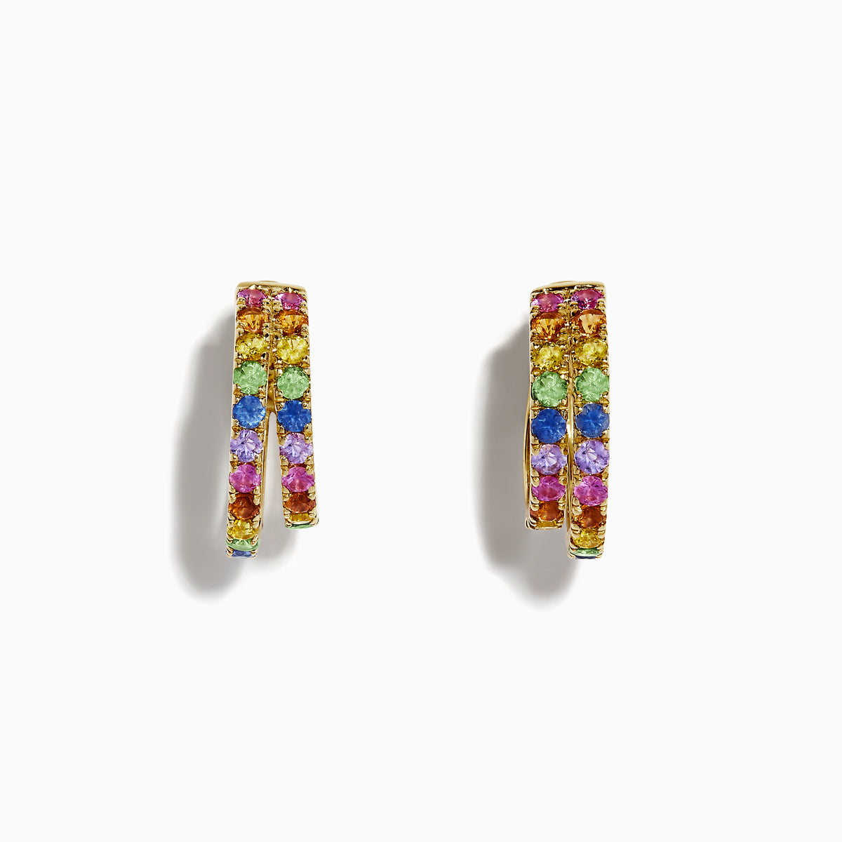 The Watercolor 14k Yellow Gold Multi Sapphire Huggie Earrings feature two rows of sapphires in vibrant yellow, pink, blue, green, and purple hues, beautifully displayed on a white background.