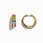 The Watercolor 14k Yellow Gold Multi Sapphire Huggie Earrings feature two rows of vibrant yellow, blue, pink, green, and purple sapphires on each earring, shown against a white background.