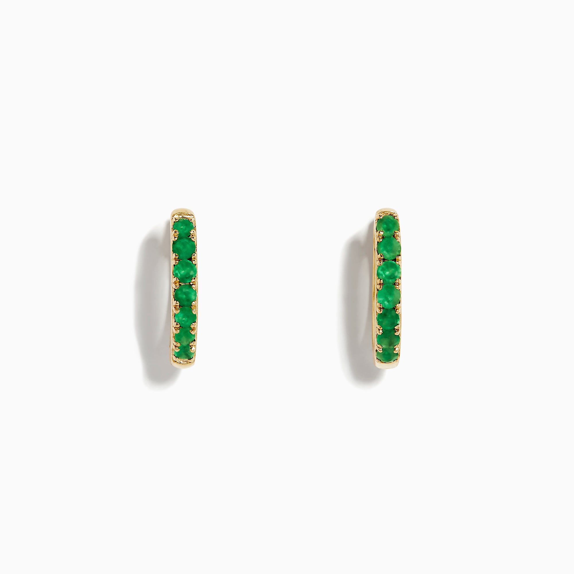 The 14K Yellow Gold Emerald Huggie Earrings feature small gold hoops set with bright green gemstones, crafted in 14K yellow gold and showcased against a white background.