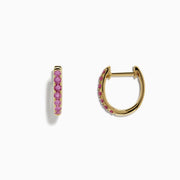 A pair of 14k Yellow Gold Pink Sapphire Huggie Earrings displayed against a plain white background.