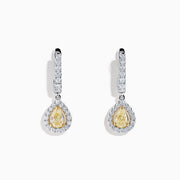 The 18K Two Tone Gold White and Yellow Diamond Drop Earrings feature teardrop-shaped yellow gems encircled by white diamonds, set in two tone gold, with diamond-studded hooks for extra brilliance.