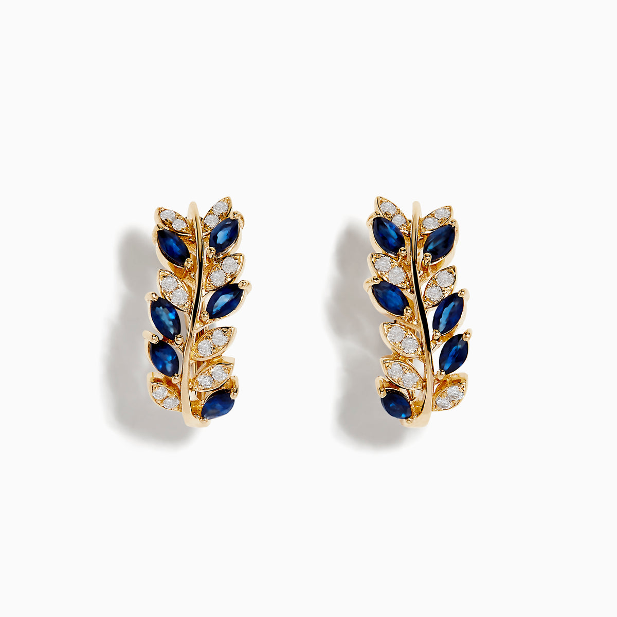 The Royale Bleu 14K Yellow Gold Blue Sapphire and Diamond Earrings feature laurel leaf shapes with alternating blue sapphires and diamonds, arranged in a delicate, natural-inspired design against a white background.